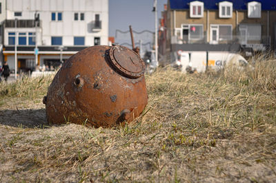 Old rusty metal on field