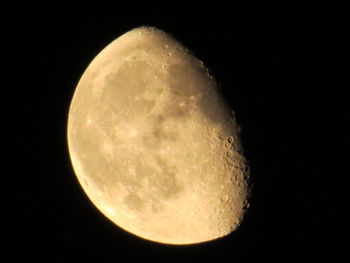 Low angle view of moon against clear sky at night