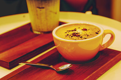 Close-up of coffee cup on table