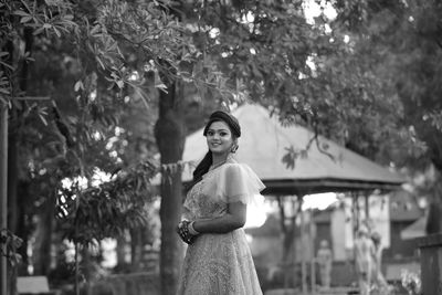 Portrait of woman standing outdoors