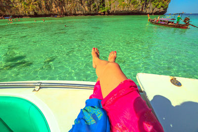 Low section of person in swimming pool