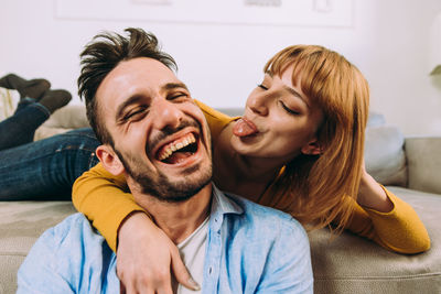 Smiling young couple at home