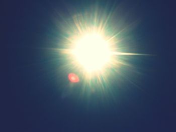 Low angle view of bright sun