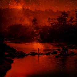 Scenic view of silhouette trees against sky during sunset