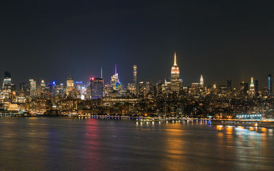 View of the manhattan at night from the hoboken