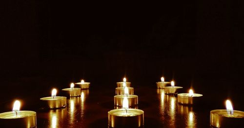 Close-up of illuminated light candles