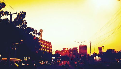 Traffic on road at sunset