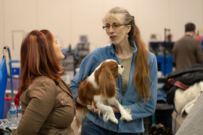 Rear view of woman with dog