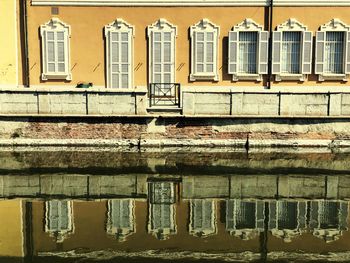 Exterior of old building by river