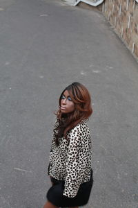 Young woman standing on street