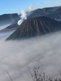 Scenic view of volcanic mountain range against sky