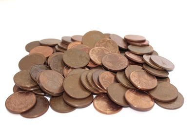 Close-up of coins on white background