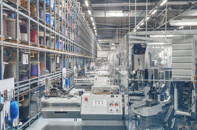 Interior of industrial workshop or shop inside for production of automotive wiring.