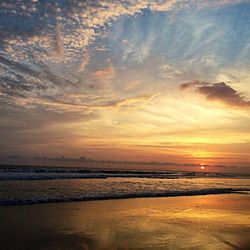 Scenic view of sea at sunset