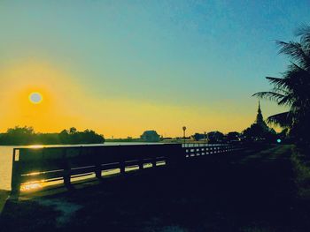 Scenic view of sea against clear sky during sunset
