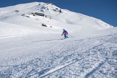 Man skiing on snowcapped mountain