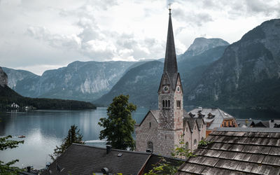 Panoramic view of lake and buildings against sky