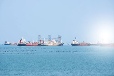 Ship in sea against clear sky