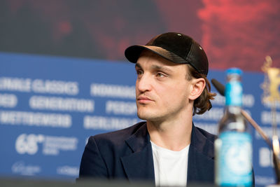 Young man against blurred background