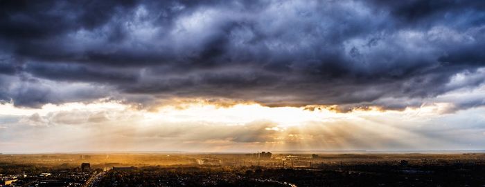 Scenic view of storm clouds over landscape