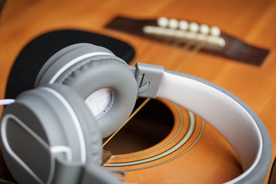 Close-up of headphones on guitar