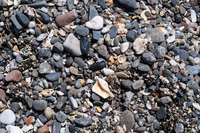 High angle view of stones on pebbles