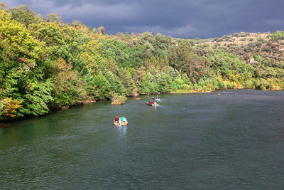 Boat tour along the tarn river in millau france . idyllic river scenery