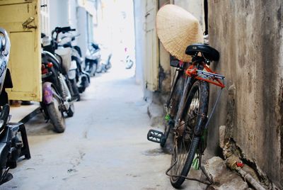 Bicycles parked on footpath by street