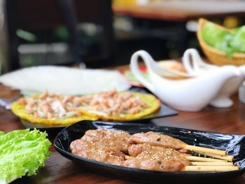 Close-up of food served on table