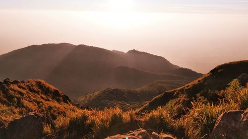 Scenic view of mountains against sky during sunset