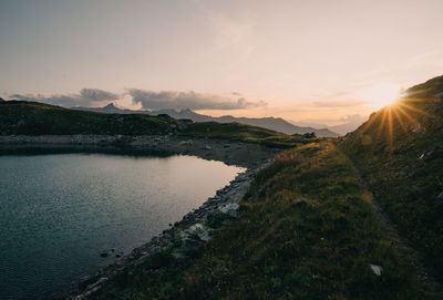 Scenic view of lake against sky during sunset