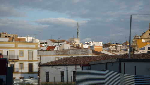 Buildings in city against sky