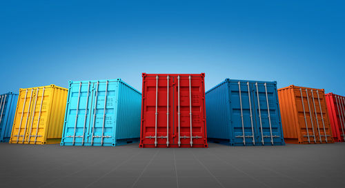 Low angle view of multi colored building against clear blue sky