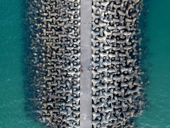 Full frame shot of metal wall by sea