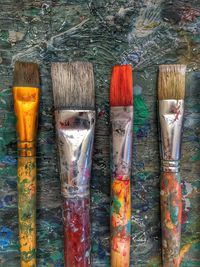 Directly above shot of paintbrushes on table