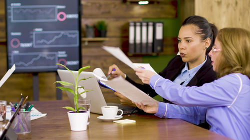 Businesswoman working at table