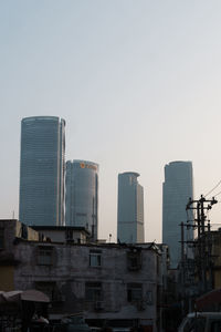 Low angle view of modern buildings against clear sky