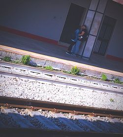 Man standing on railroad track