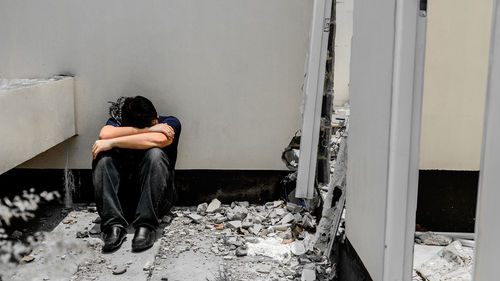 Man sitting on wall