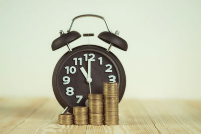 Close-up of clock on table