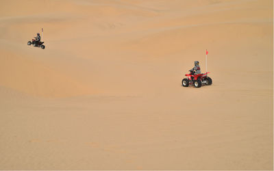 Man in car on desert