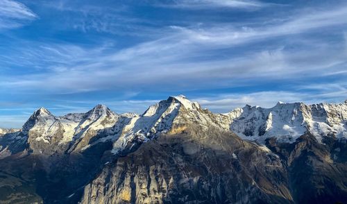 Scenic view of snowcapped mountains against sky