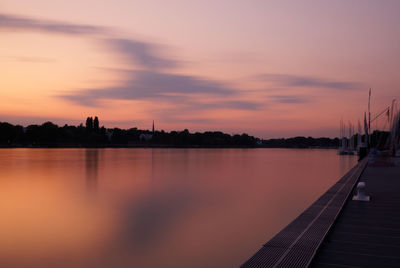 Scenic view of lake against sky during sunset