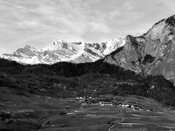 Scenic view of snowcapped mountains against sky