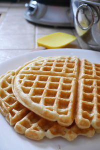 Close-up of waffles in plate on table