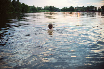 Portrait of person swimming in lake