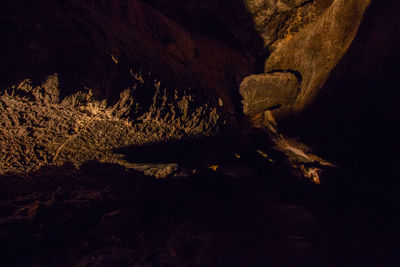 Scenic view of rock formations against sky at night