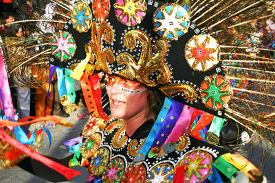 Full length portrait of smiling woman wearing mask