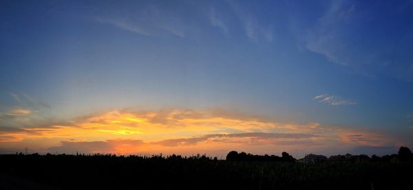 Scenic view of landscape at sunset