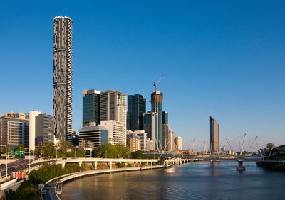 Bridge over river with buildings in background